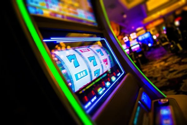 Live blackjack dealer table with player interface on screen